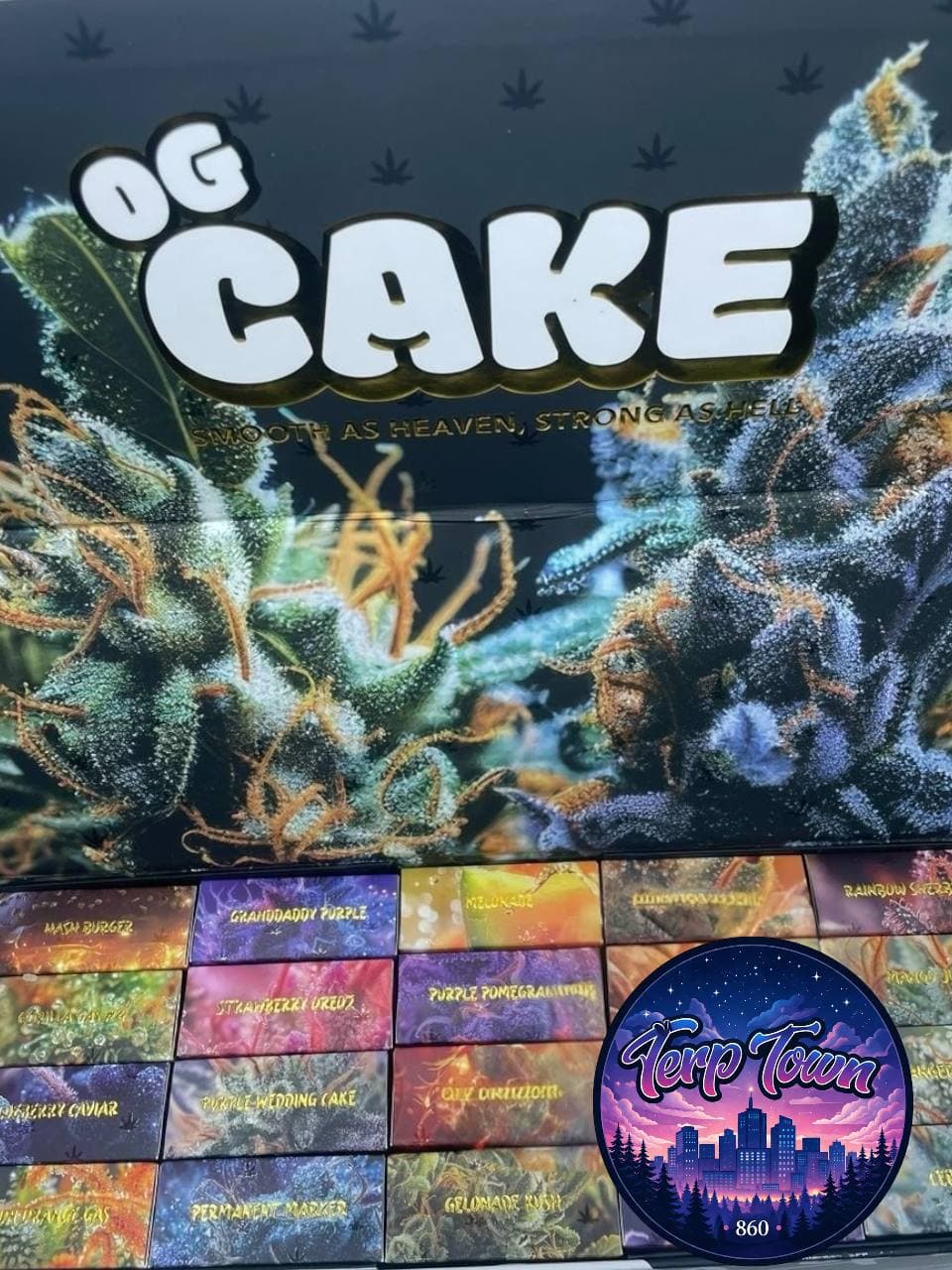 OG Cake cannabis packaging featuring detailed buds, colorful strain boxes, and Terp Town logo.
