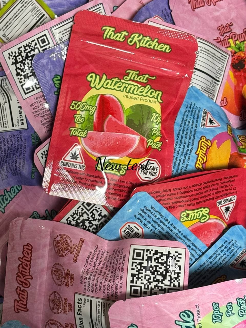 Pile of colorful "That Kitchen" brand cannabis-infused edible pouches with watermelon and sour flavors.